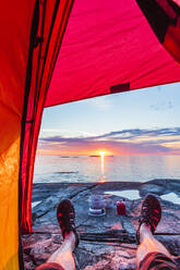 Man in tent at sunset - JOHF03807