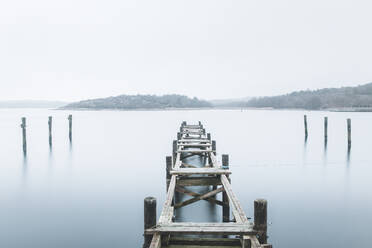 Wooden groyne and jetty on lake - JOHF03831