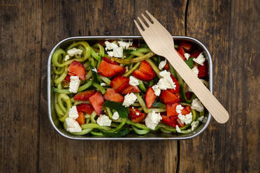 Metal lunchbox with cucumber and strawberry salad mixed with feta cheese, mint and balsamic vinegar - LVF08339