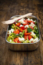 Metal lunchbox with cucumber and strawberry salad mixed with feta cheese, mint and balsamic vinegar - LVF08340