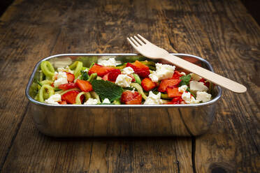 Metal lunchbox with cucumber and strawberry salad mixed with feta cheese, mint and balsamic vinegar - LVF08341