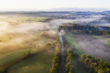 Germany, Bavaria, Geretsried, Aerial view of Loisach river canal at foggy dawn - SIEF09164