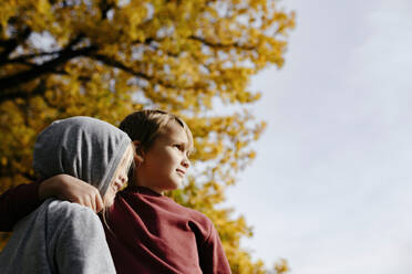 Two siblings enjoying autumn - EYAF00586