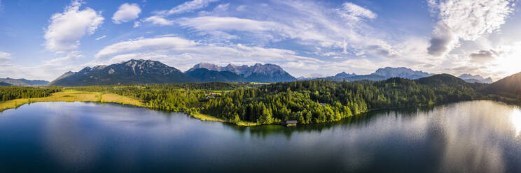 Germany, Bavaria, Scenic panorama of Wetterstein mountains and Barmsee lake at sunset - STSF02292