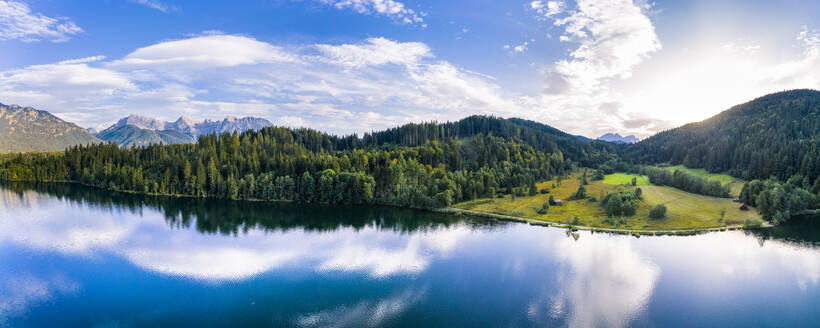 Germany, Bavaria, Scenic panorama of Wetterstein mountains and Barmsee lake at sunset - STSF02294