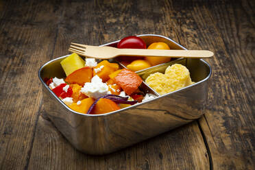 Metal lunchbox with salad made of oven-baked vegetables and heart-shaped polenta - LVF08351