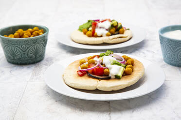 Israeli sabich with pita bread, eggplant, chick-peas, onion, tomato, cucumber, yogurt and zhug sauce - LVF08358