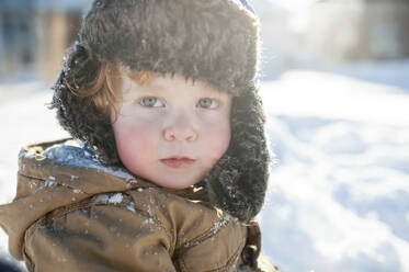 Young boy in warm winter thermal suit clothing outdoor portrait in snow  Model Release: Yes. Property Release: No Stock Photo - Alamy