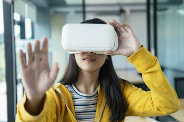 Young programmer with virtual reality glasses to testing 3D appl - CAVF65389