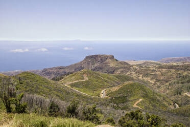 Spain, Canary Islands, La Gomera, Winding road in front of Table Mountain seen from summit of Garajonay - MAMF00891