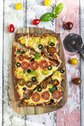 Low carb flax seed pizza with cheese, cherry tomatoes, olives and basil - SARF04386