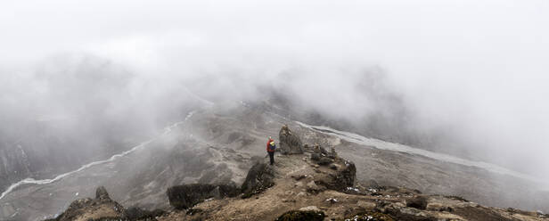 Woman looking at Dingboche, Himalayas, Solo Khumbu, Nepal - ALRF01607