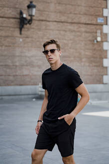 Portrait of a young stylish man in the city - JMHMF00029