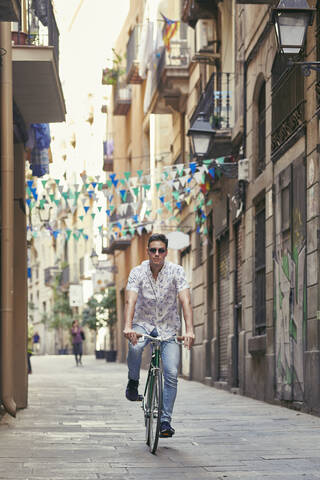 Man riding bicycle in the city stock photo