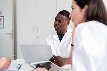 Doctors having discussion in meeting room - ISF22147