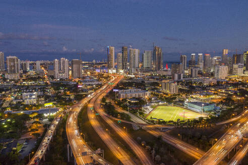 Highways intersections merging with Highway US 1 through downtown Miami at night, aerial view, Miami, Florida, United States - ISF22210