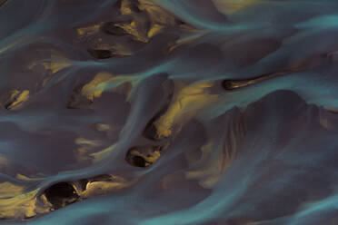 Glacial rivers seen from above, the different colors suggest the moving of different sediments at the end of the summer season. The fresh glacier water is mixing with the salt from the ocean, Iceland - AAEF04595