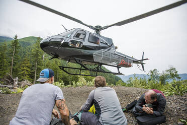 Helicopter drops off three men at a remote destination in B.C. - CAVF65771