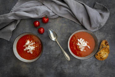 Bowls of vegan tomato soup with coconut flakes - LVF08373