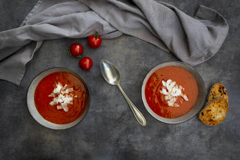 Bowls of vegan tomato soup with coconut flakes - LVF08373