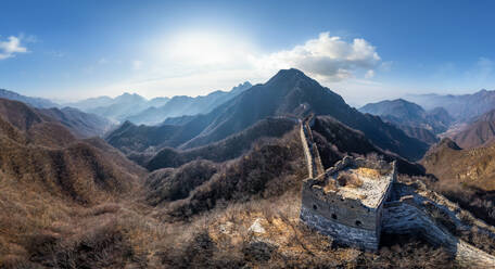 Aerial view of the Great Wall of China crossing mountain chain. - AAEF04756