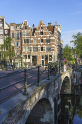Old gabled buildings by a bridge on Prinsengracht, Amsterdam, North Holland, The Netherlands, Europe - RHPLF12311