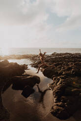 Swimmer enjoying enclosed sea pool, Princeville, Hawaii, US - ISF22517