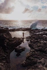 Swimmer enjoying enclosed sea pool, Princeville, Hawaii, US - ISF22520