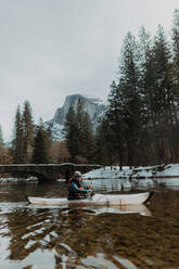 Man kayaking in lake, Yosemite Village, California, United States - ISF22562