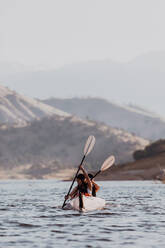 Friends kayaking in lake, Kaweah, California, United States - ISF22583