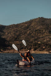 Friends kayaking in lake, Kaweah, California, United States - ISF22584