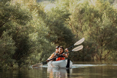 Friends kayaking in lake, Kaweah, California, United States - ISF22588