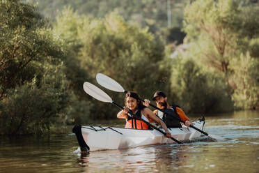 Friends kayaking in lake, Kaweah, California, United States - ISF22589