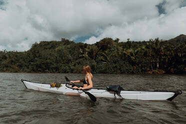 Woman kayaking, Princeville, Hawaii, US - ISF22617