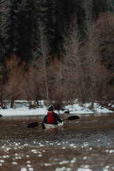Man kayaking in lake, Yosemite Village, California, United States - ISF22622