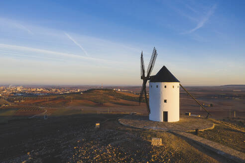 Spain, Province of Ciudad Real, Alcazar de San Juan, Countryside windmill at dusk - WPEF02126