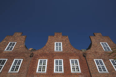 Germany, Brandenburg, Potsdam, Low angle view of brick houses of Dutch Quarter neighborhood - ASCF01049