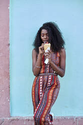 Portrait of young woman enjoying ice cream - VEGF00776