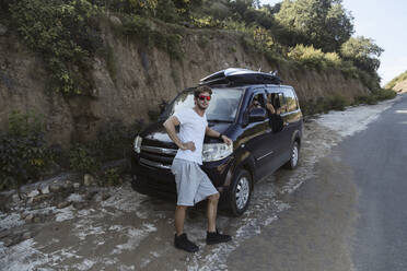 Young man staying near car - CAVF65898