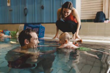 Father with baby in swimming-pool - JOHF04548