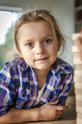 Portrait of girl leaning on table - EGBF00376