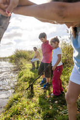 Children playing at water course, Darss, Mecklenburg-Western Pomerania, Germany - EGBF00464