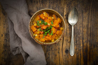 Bowl of spicy oriental pumpkin stew with chick-peas, parsley and Hokkaido squash - LVF08387