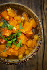 Bowl of spicy oriental pumpkin stew with chick-peas, parsley and Hokkaido squash - LVF08389