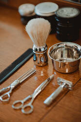 Hairdressing and shaving tools on table - CUF52885