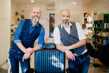 Happy business partners in barber shop - CUF52907