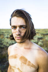 Portrait of confident shirtless man at Bridger-Teton National Forest - CAVF66781