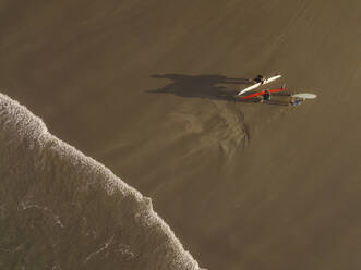Aerial view of surfers at the beach - CAVF66861