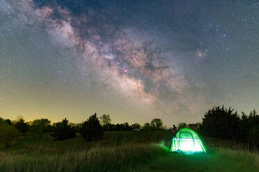 Backcountry camping in a lamp-lit tent under stars and the Milky way - CAVF66963