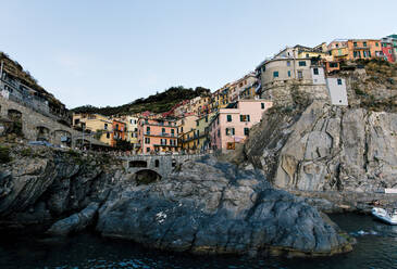 Town on cliff by sea against clear sky - CAVF67230